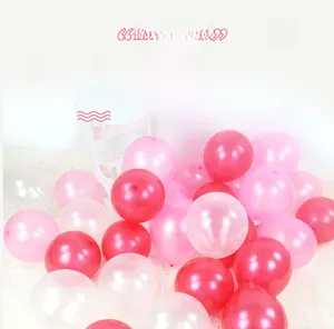 Detail of pearlescent pink and white latex balloons for party arch decoration