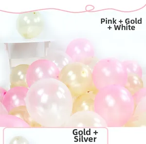 Detailed stack of pink, gold, and white pearlescent latex balloons for party decoration