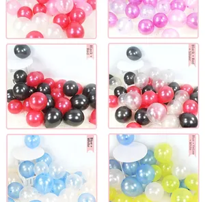 Detailed grid of colorful pearlescent latex balloons in red black and blue yellow combinations