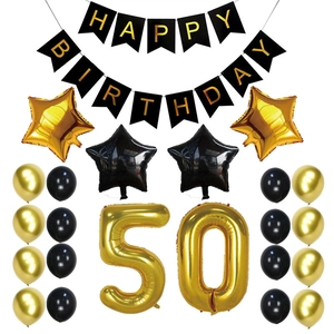 50th birthday party set with gold number 50 balloons and happy birthday banner