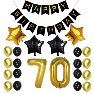 70th Birthday black and gold party decorations with balloons and happy birthday banner