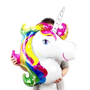 Large unicorn foil balloon held by person showing giant size for birthday parties