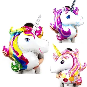 Large unicorn head foil balloons in rainbow, purple, and pink floral designs for birthdays