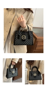 Detailed close-up of a black tote bag with 'M' logo pattern and golden metal hardware