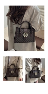Detailed view of structured brown monogram tote bag with gold M-logo buckle and leather strap