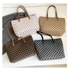 Detailed display of four large checkered tote bags in various vintage color patterns