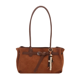 Vintage brown suede handbag for women featuring a retro wooden bead charm and silver buckle