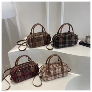 Detail of plaid patterned wool handbags in four colors with leather straps and gold hardware