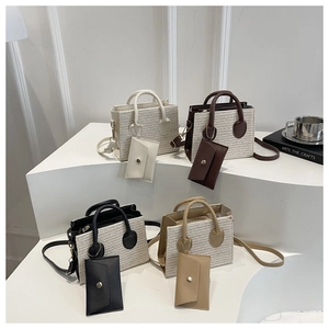 Detail of four mini tote bags in leather and woven straw textures with small card pouches