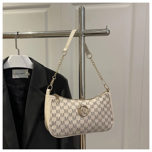 Detail of vintage monogram shoulder bag with gold chain and metal M logo buckle