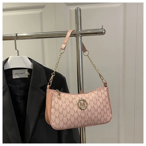 Pink baguette shoulder bag with M letter pattern, gold chain strap, and metallic logo detail