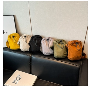 Detailed group view of colorful nylon mini crossbody bags with adjustable straps