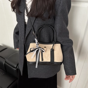 Beige leopard texture suede bucket bag with black leather trim and lace bow decoration