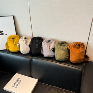 Mini nylon drawstring crossbody bags for water bottles and phones in six vibrant colors