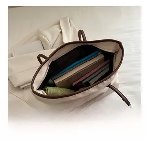 Macro view of nylon tote interior with leather trim showing spacious storage capacity