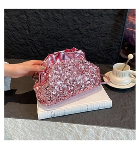 Detail of pink sequin cloud bag with ruffled texture and metallic finish edges