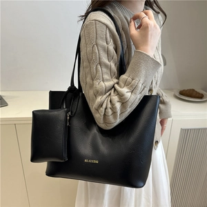 Minimalist black leather tote bag set with shoulder strap and small pouch for daily use