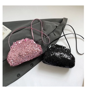 Detail of pink and black sequined cloud bags with pleated edges and chain straps