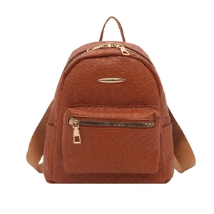 Brown woven texture faux leather backpack with gold hardware on white background