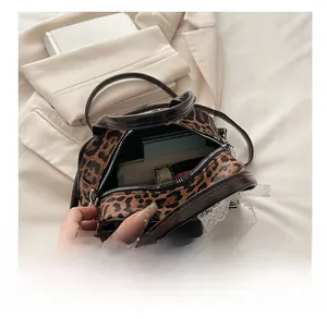Detailed interior view of leopard print Boston bag showing capacity for daily essentials