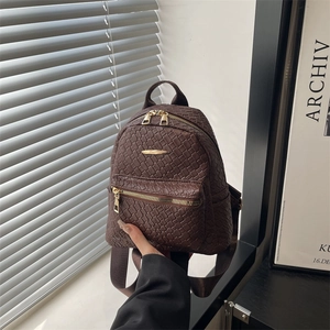 Women's vintage dark brown woven leather backpack with gold zippers and large capacity
