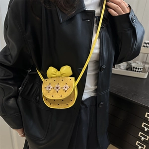 Yellow girl's mini crossbody bag with 3D floral accents and a large bow decoration