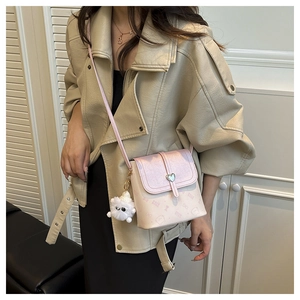 Pink gradient crossbody bag detail with silver heart buckle and cute bear print pattern