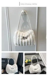 Detailed view of white plush bucket bag with vertical stripes and silver bow buckle