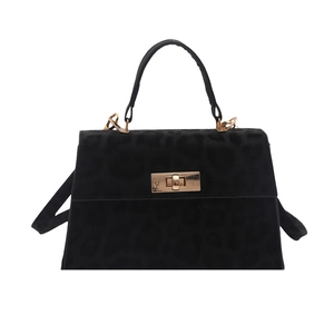 Minimalist black leopard print handbag with golden twist lock and leather handle