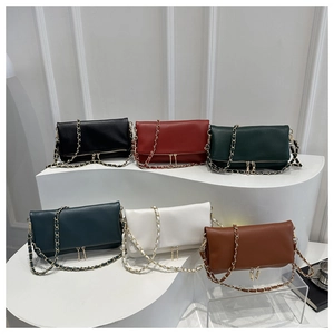 Selection of colorful lychee texture shoulder bags with chain straps and tassel detail