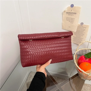 Elegant large capacity burgundy woven clutch bag featuring minimalist leather texture design