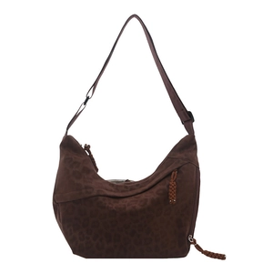 Leopard print crossbody bag with half-moon shape and adjustable shoulder strap
