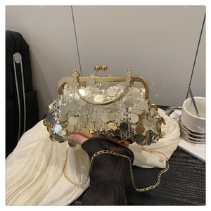 Detailed view of the gold sequin evening bag with a vintage metal clasp and chain