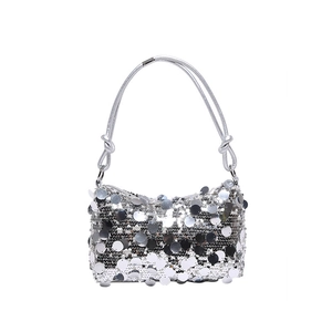Silver sequin shoulder bag with knot handle and Y2K aesthetic for parties