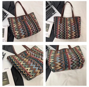Detail of bohemian geometric pattern tote bag with leather handles and metal rivets