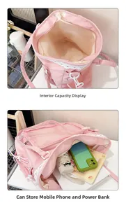 Pink lace canvas bag detail showing spacious dual compartments for phone and notebook