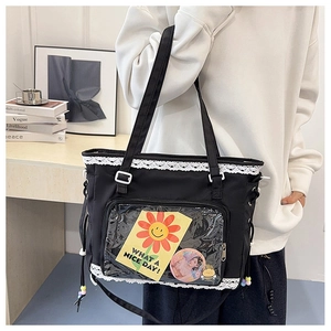 Black ita bag detail with lace trim, large PVC window, and crossbody shoulder strap