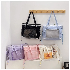 Detailed display of five colorful lace-trimmed clear canvas bags for anime badges