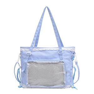 Cute light blue ita bag with clear mesh pocket, white lace trim and drawstring details