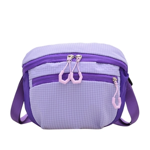 Minimalist nylon crossbody bag in purple with textured grid pattern and multi-zipper compartments
