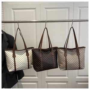 Three large retro tote bags with classic monogram print in cream brown and taupe colors