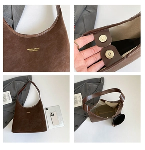 Detail of brown hobo bag showing magnetic metal buckle and large interior capacity