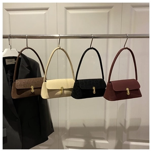 Selection of baguette shoulder bags with velvet finish and gold J-shaped metal buckle