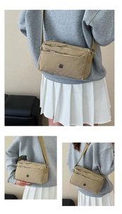 Detail of light khaki nylon crossbody bag with multi-layer pockets and round logo