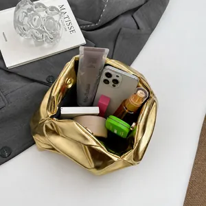 Top view showing the large storage capacity of the metallic pleated cloud clutch bag