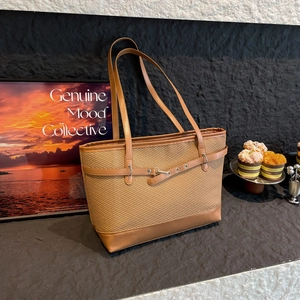 Brown woven patchwork tote bag with faux leather straps and metal buckle detail