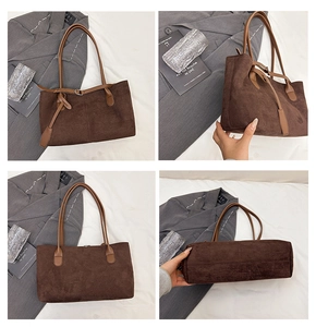 Détails du grand sac cabas en daim marron montrant les coutures et la base