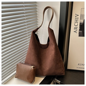 Detail of vintage brown frosted tote bag set with matching pouch and leather strap