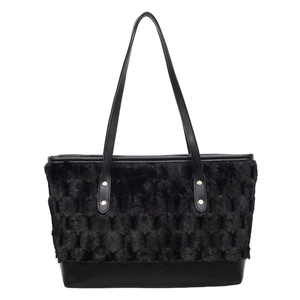 Black faux fur tote bag with honeycomb texture and smooth leather base details