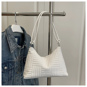 Detail of the white woven texture and silver rings on this large shoulder tote bag